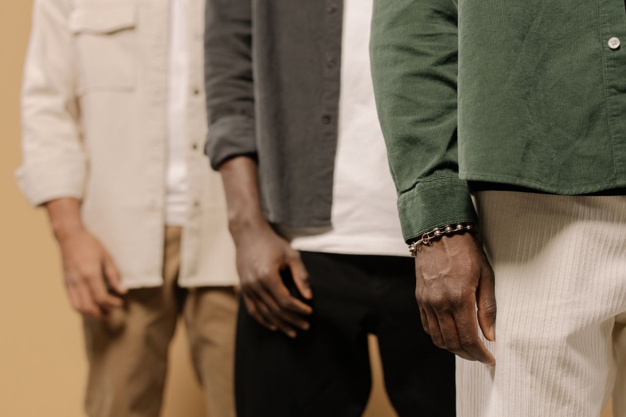 Crafting Captivating Headlines: Your awesome post title goes here Stylish men's fashion shoot showcasing casual shirts and pants in neutral tones.